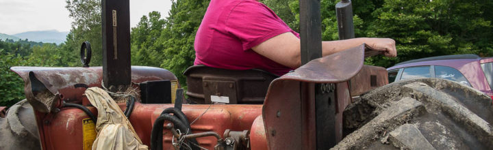 Donna Sprague driving her tractor
